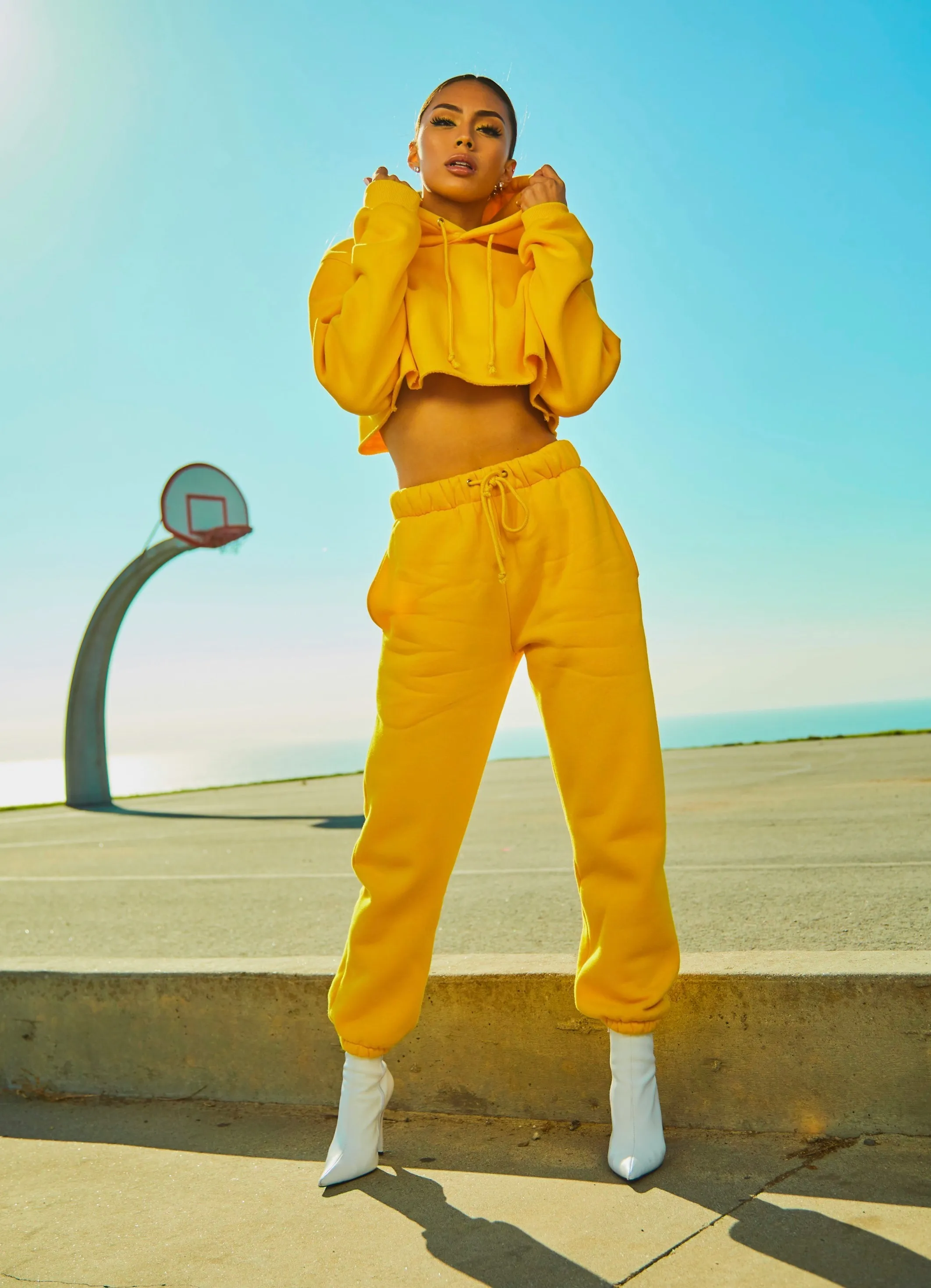 A full-length photo, with a close crop of the subject made for a smaller layout
